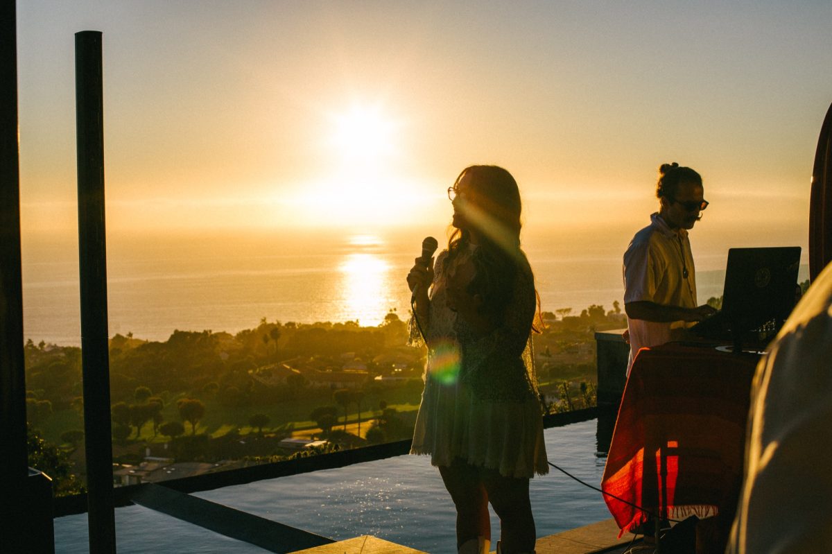 Singer performing at sunset at a produced event