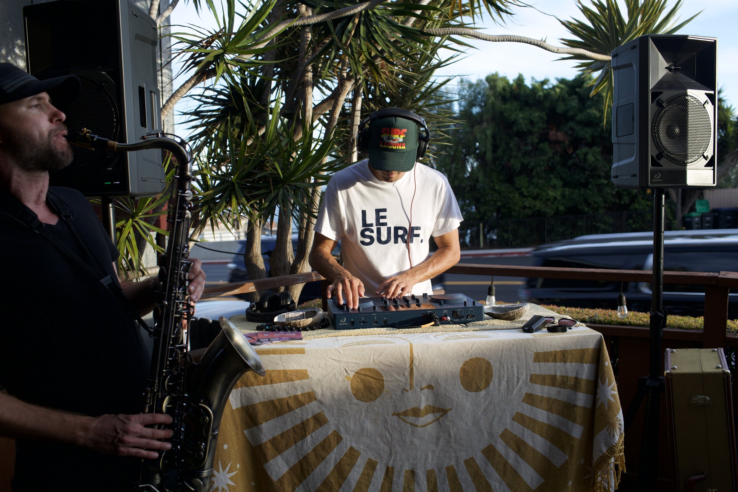 Scott Welch DJing golden hour with live saxophone
